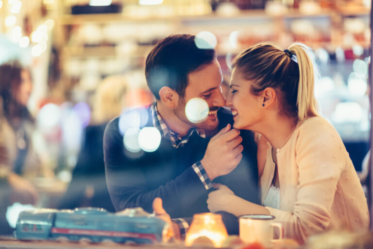 A smiling couple enjoys a romantic date night.