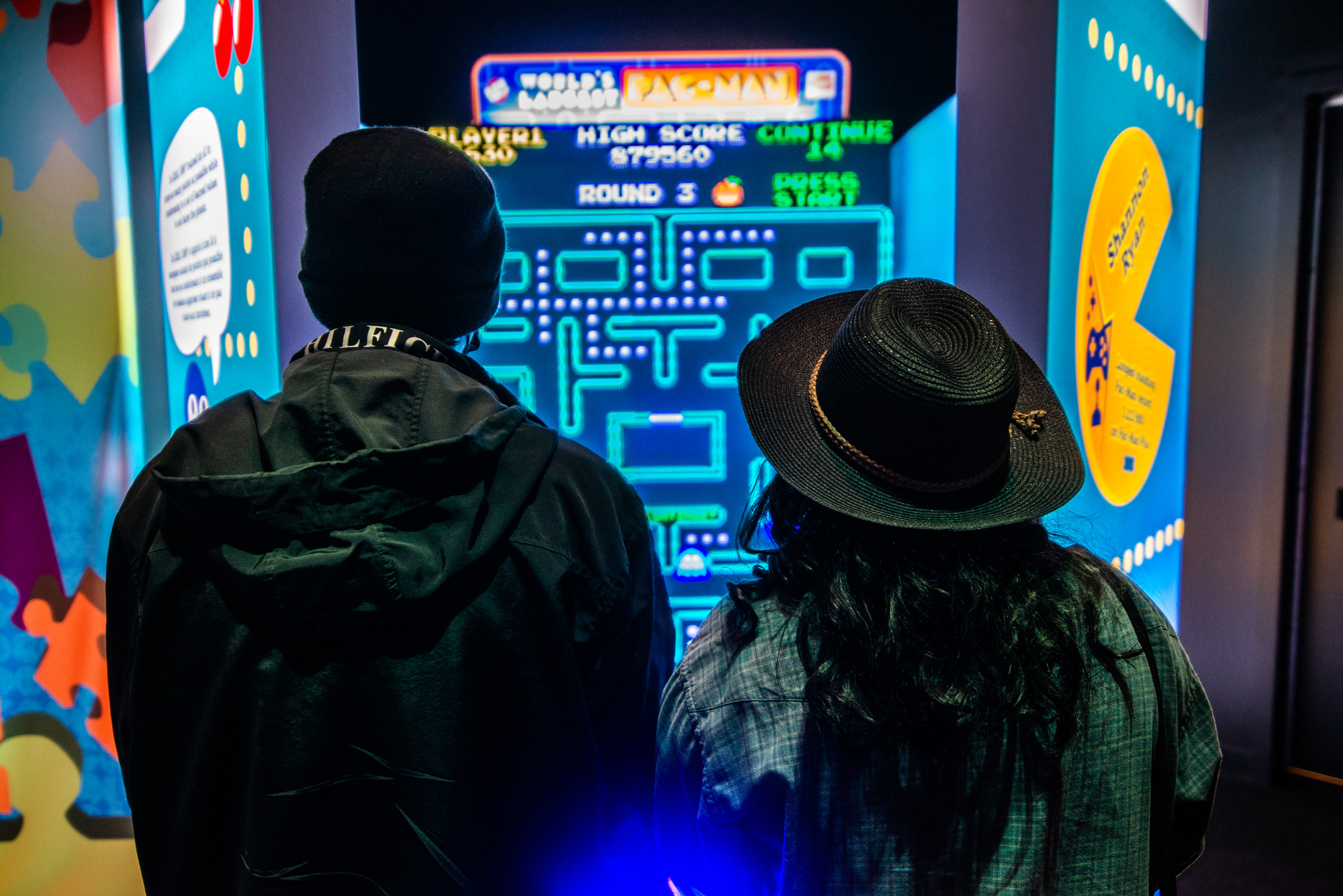Couple playing Pac Mac at The Science of Guinness World Records