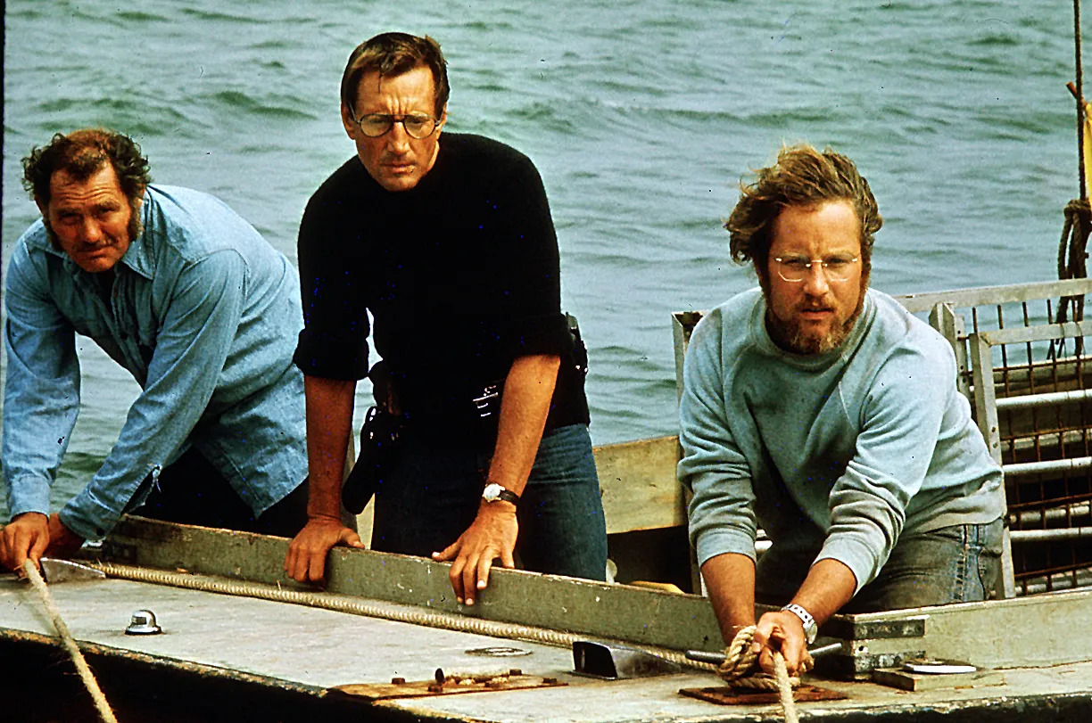 Image from the movie Jaws. Showing 3 men on a boat.