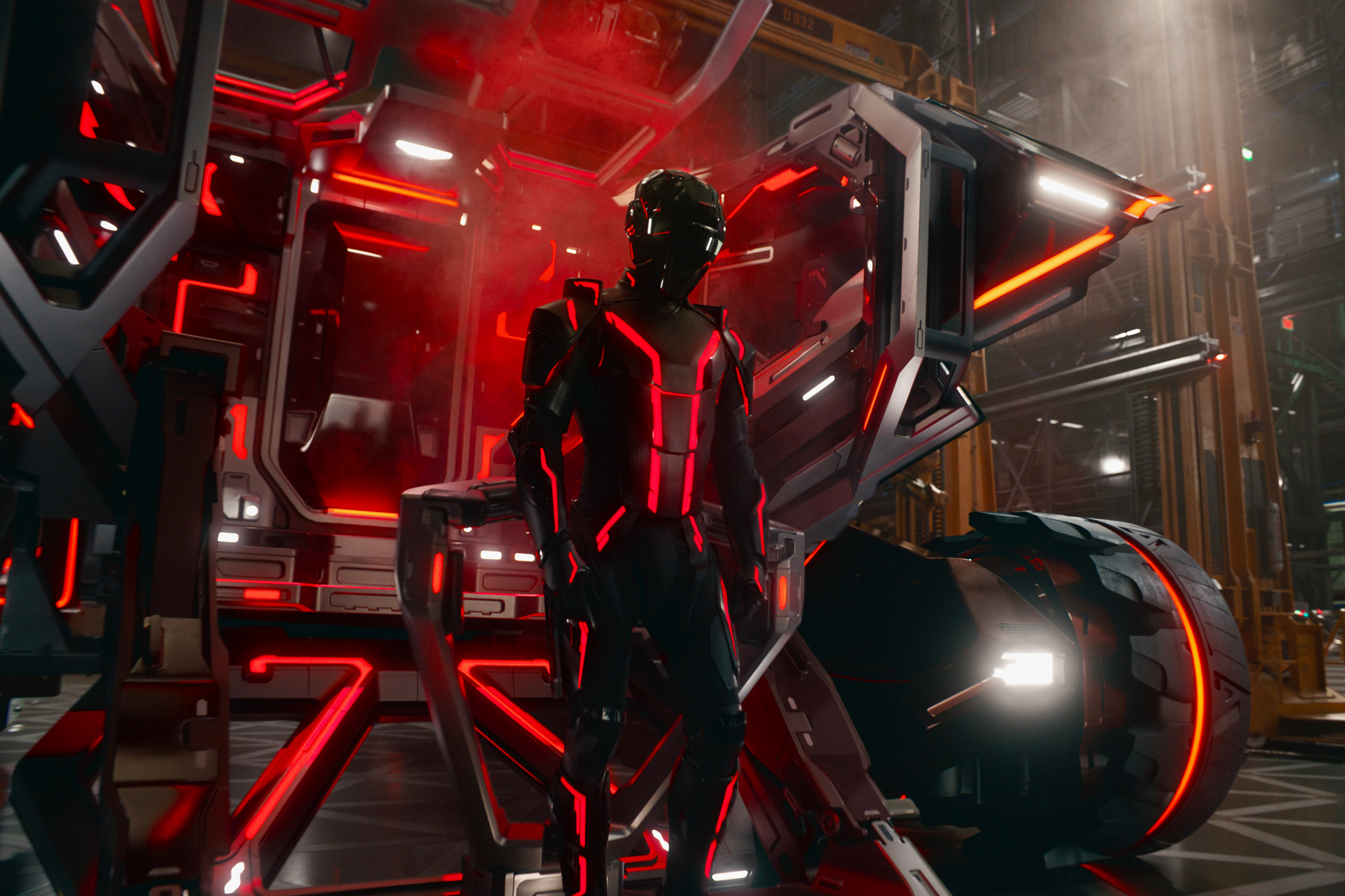 Image from Tron: Ares showing a rider next to a light bike.