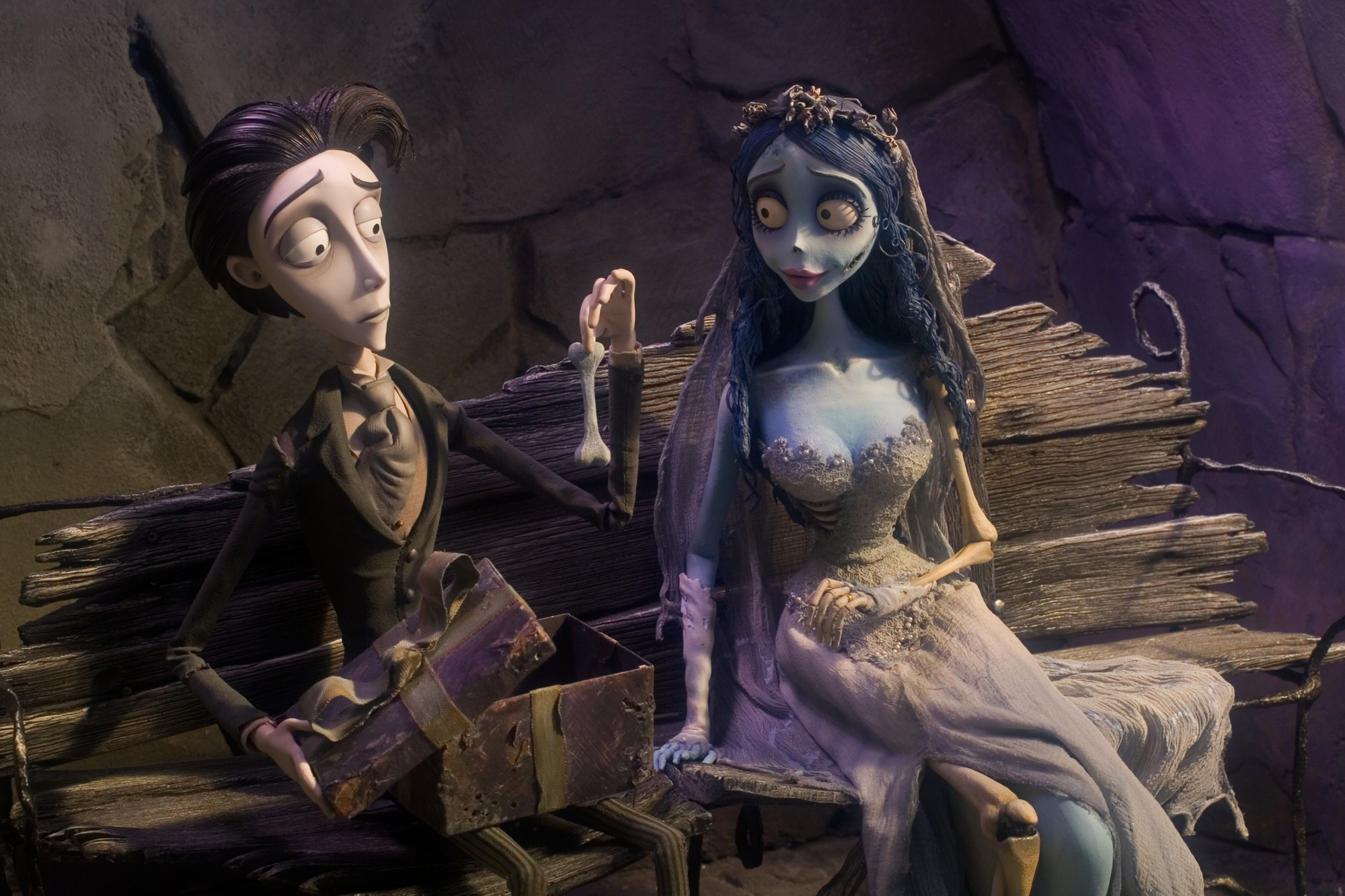 Still image from Corpse Bride showing 2 characters sitting on a bench.