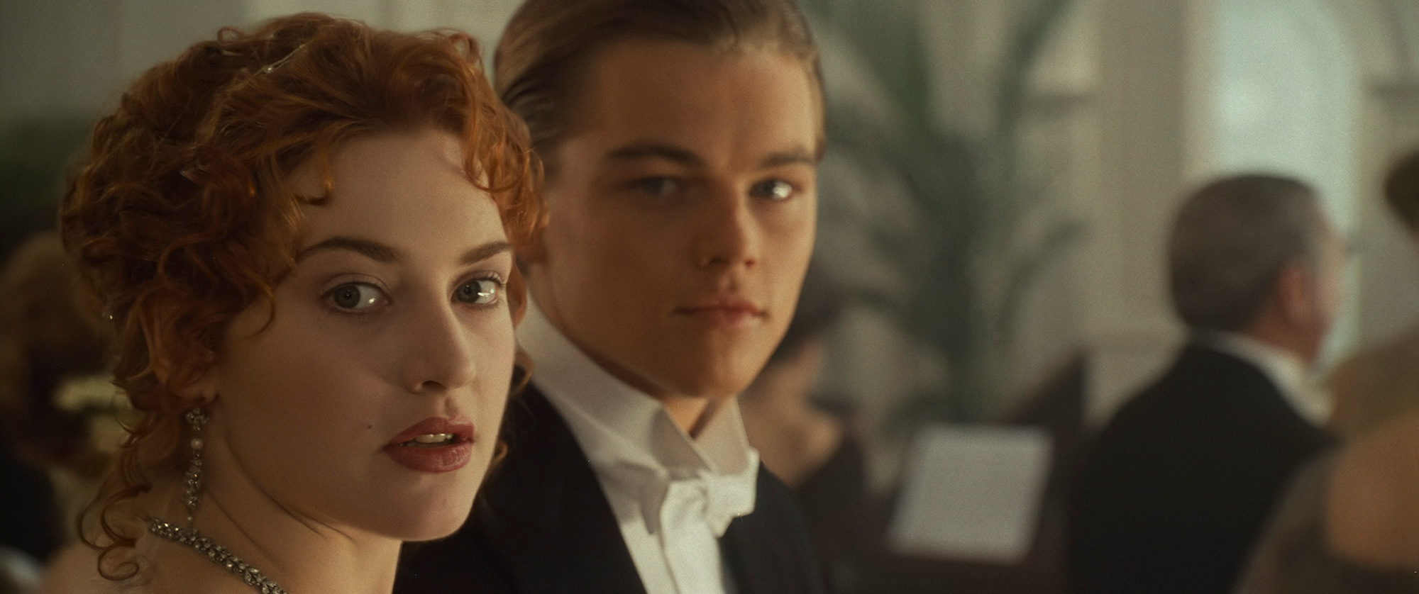 Still image from Titanic, showing Jack and Rose at dinner.
