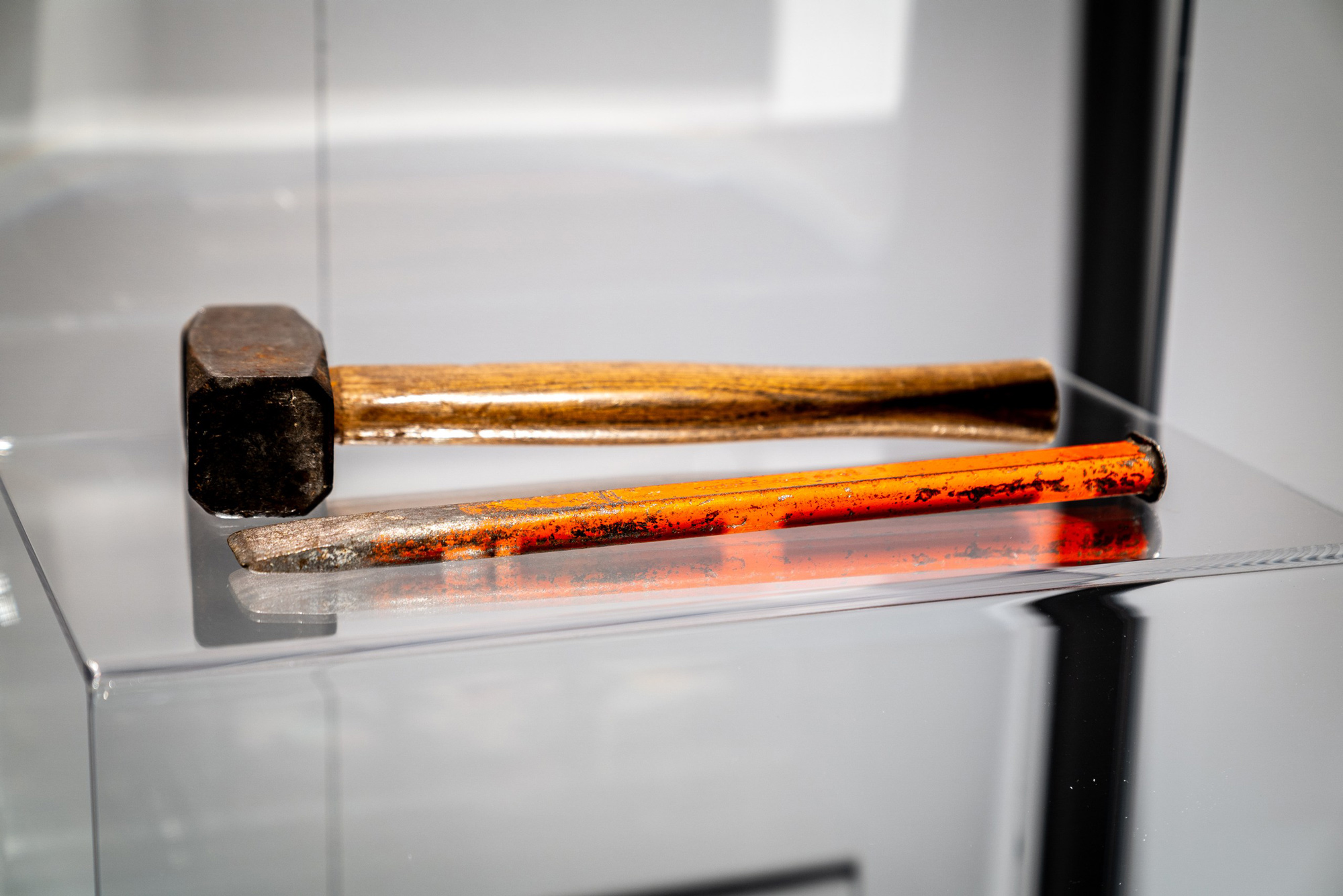 A hammer and chisel that are on display inside of The Berlin Wall. A World Divided.