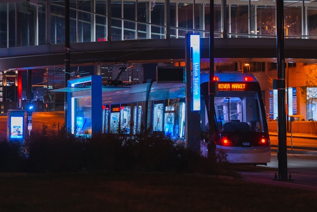 Night view of the street car in Kansas City making a stop at the Union Station Stop.