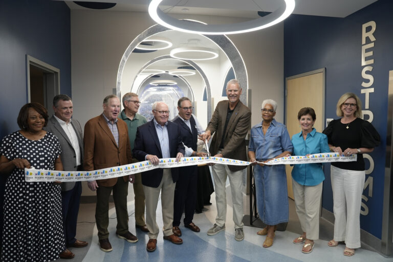 Ribbon cutting for Science City's new bathroom. Featuring various members of Union Station's board and CEO.